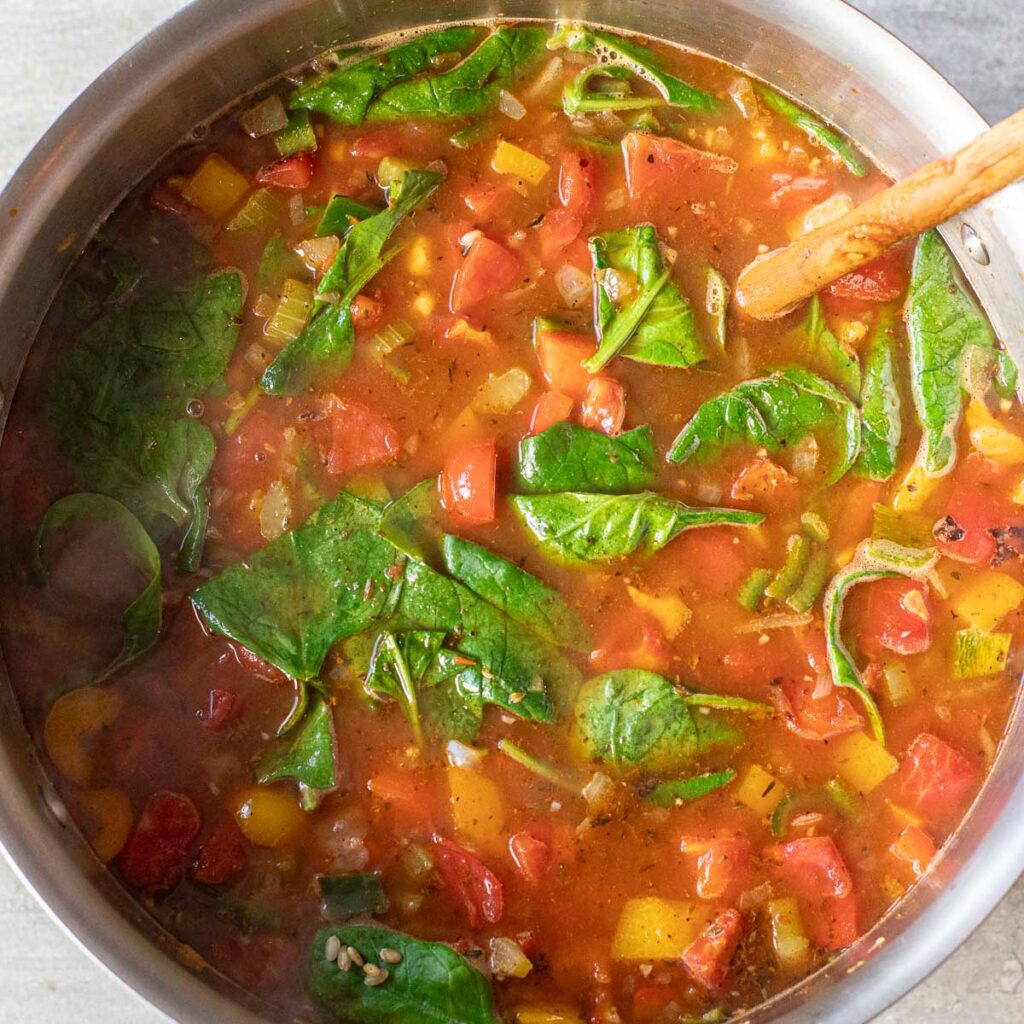 garden vegetable soup cooking in a stock pot