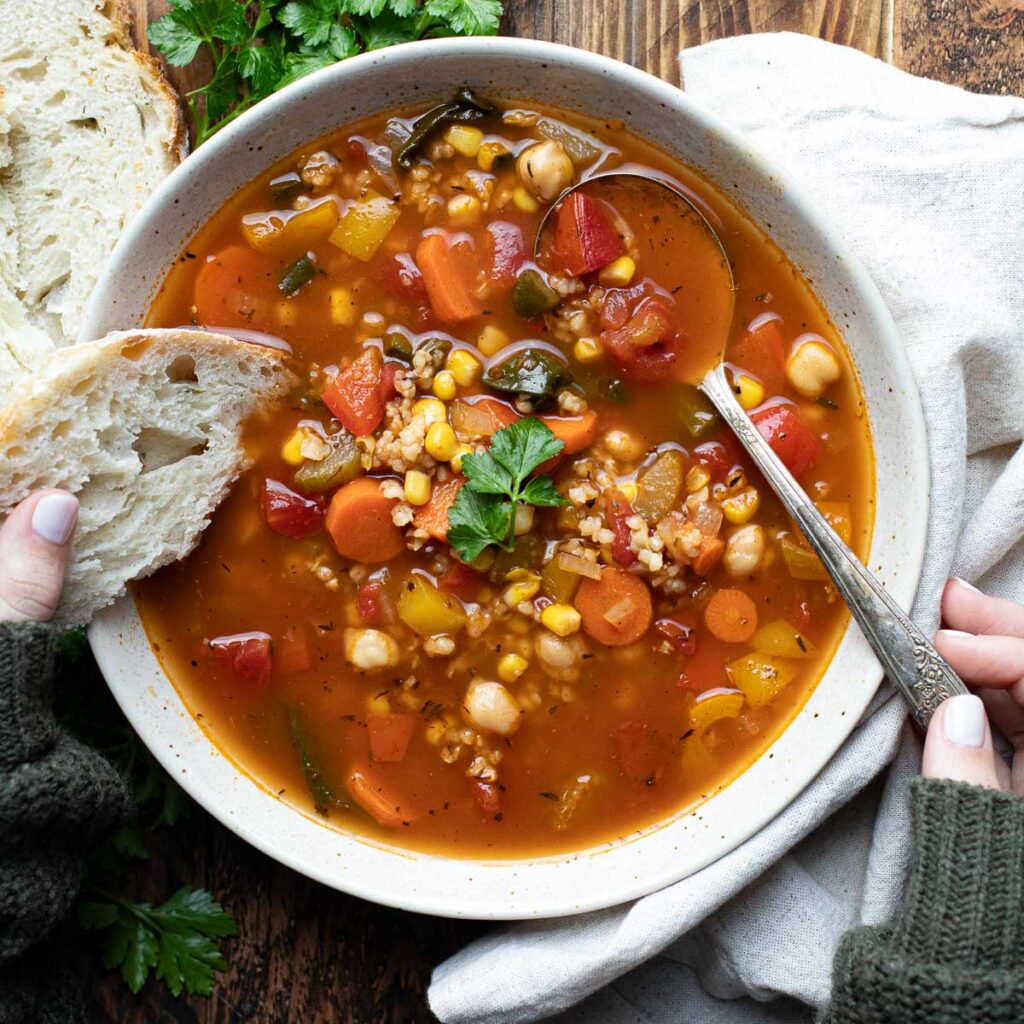 Panera bread garden vegetable soup with a silver spoon