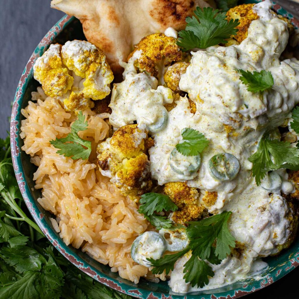 Indian cauliflower curry over rice with fresh cilantro