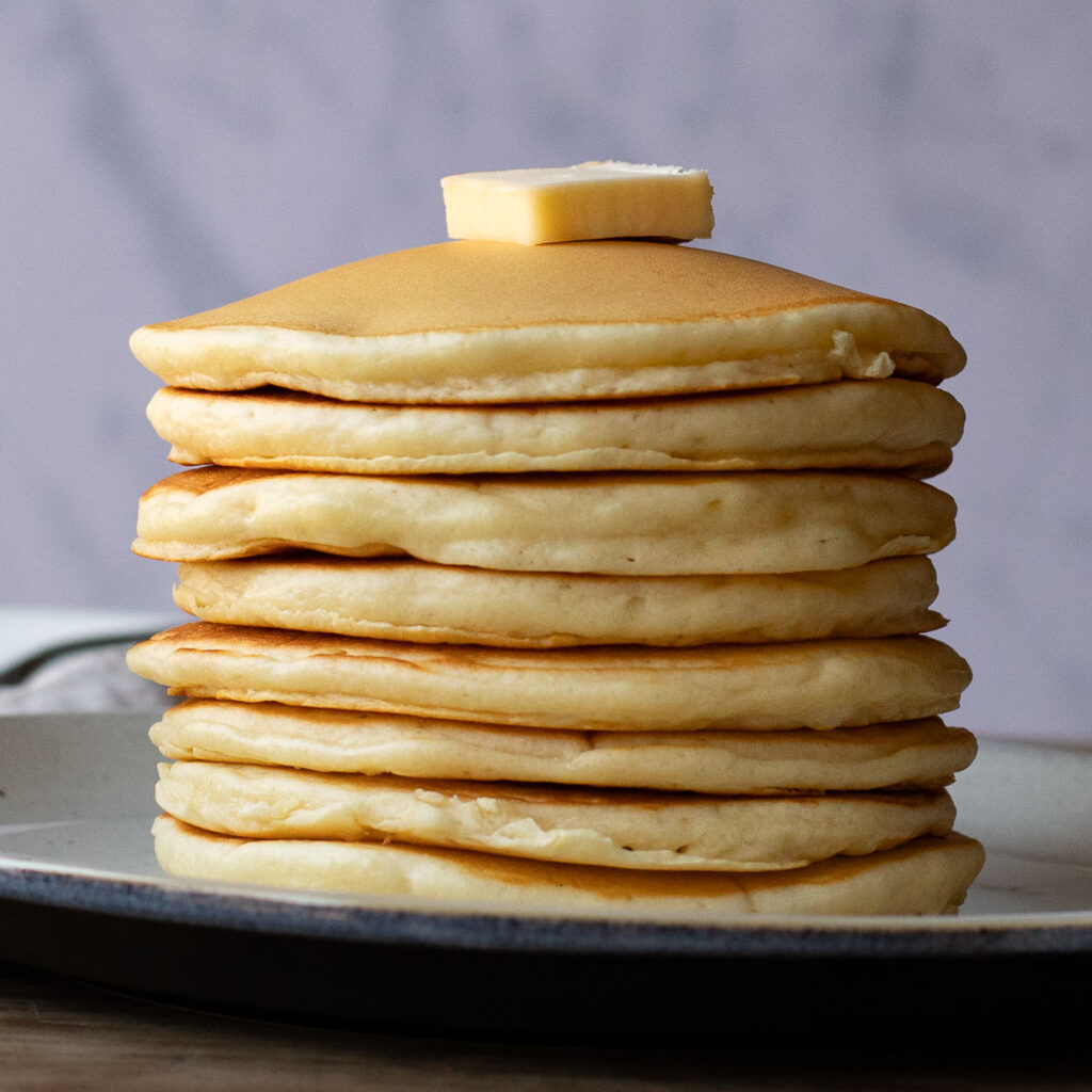 a stack of McDonald's pancakes with a pat of butter on top
