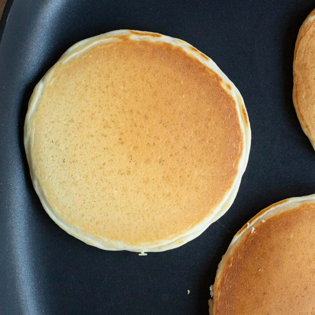 pancakes cooking in a pan