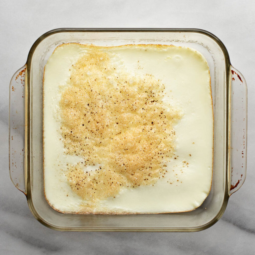 baked egg whites in a square glass baking dish