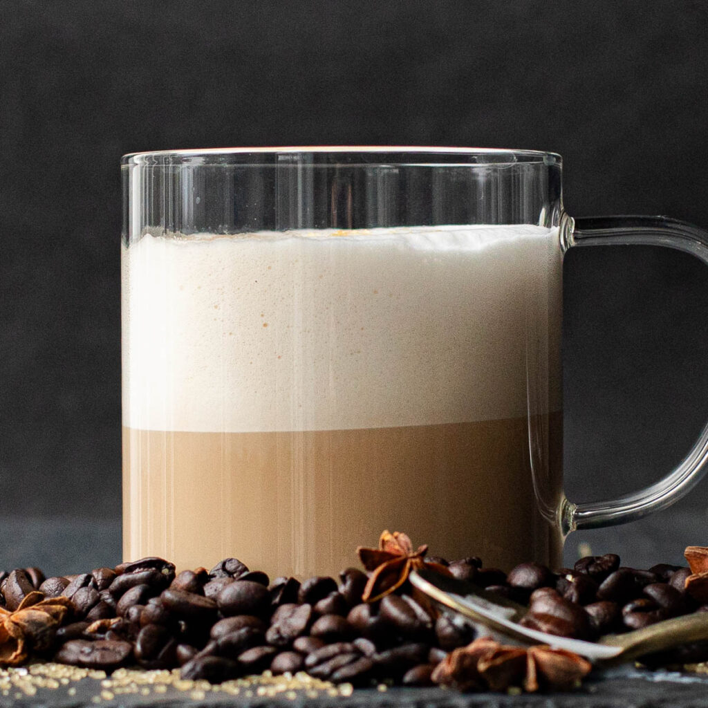 vanilla latte made with vanilla syrup in a glass mug