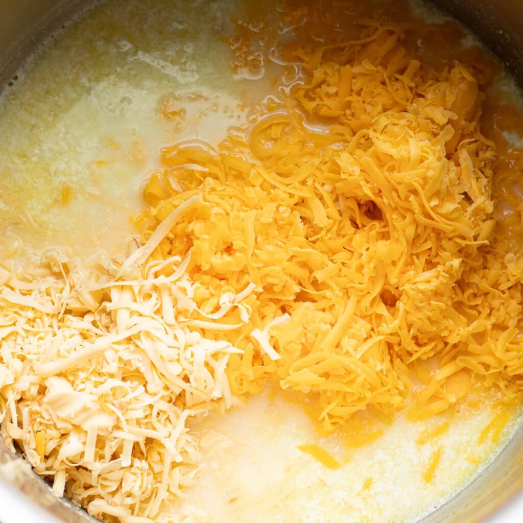 grated cheeses in a pot