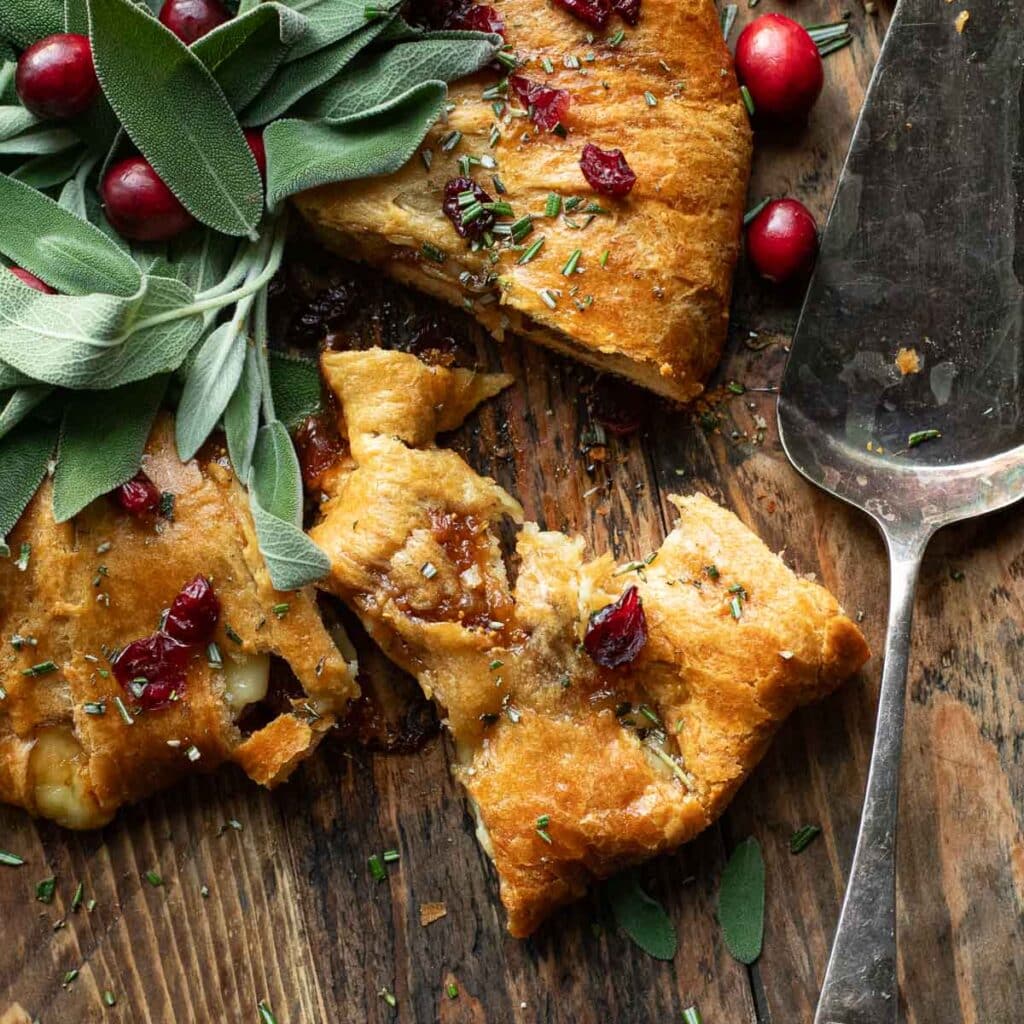baked brie crescent roll wreath with one slice cut out