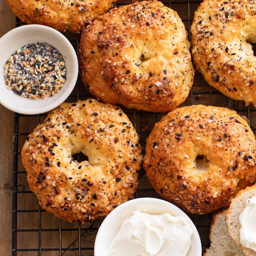 cottage cheese bagels with everything seasoning on a wire rack