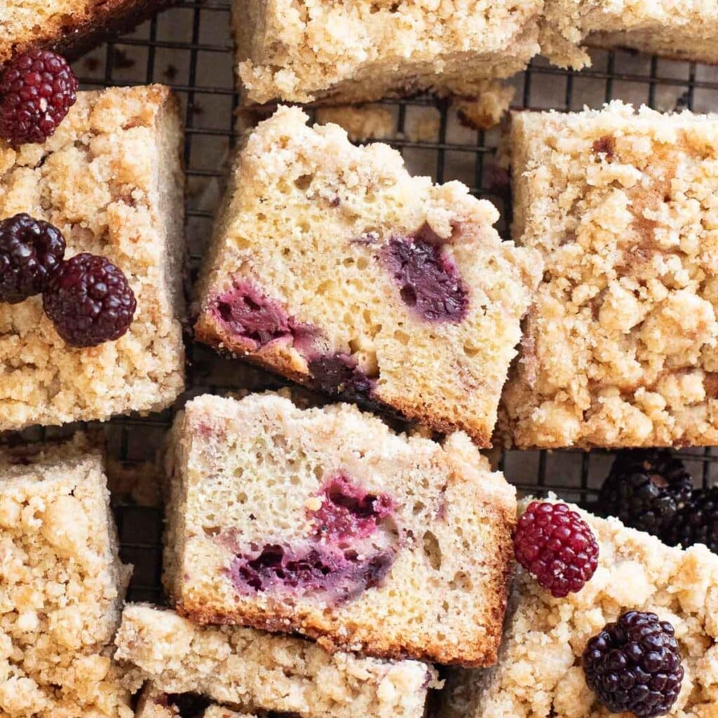 pieces of blackberry coffee cake on a wire rack