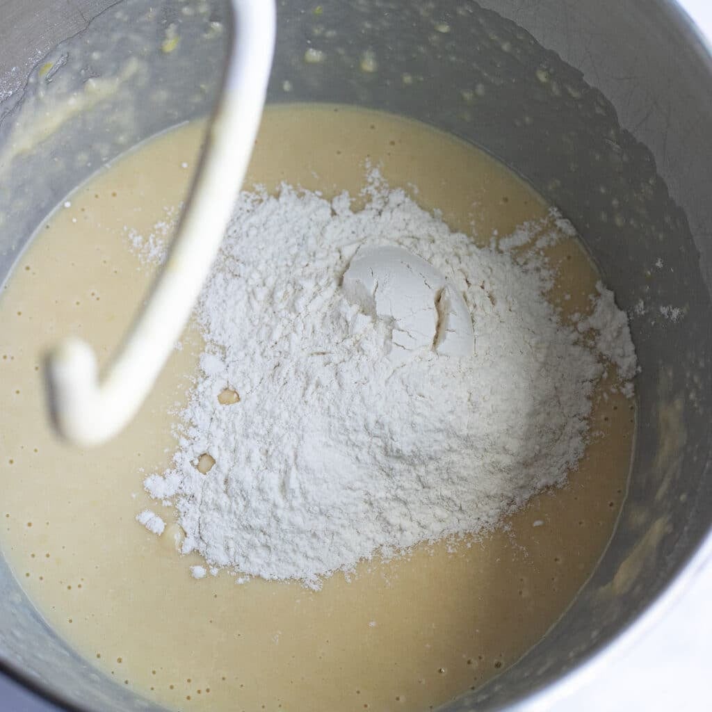 flour being added to bread batter