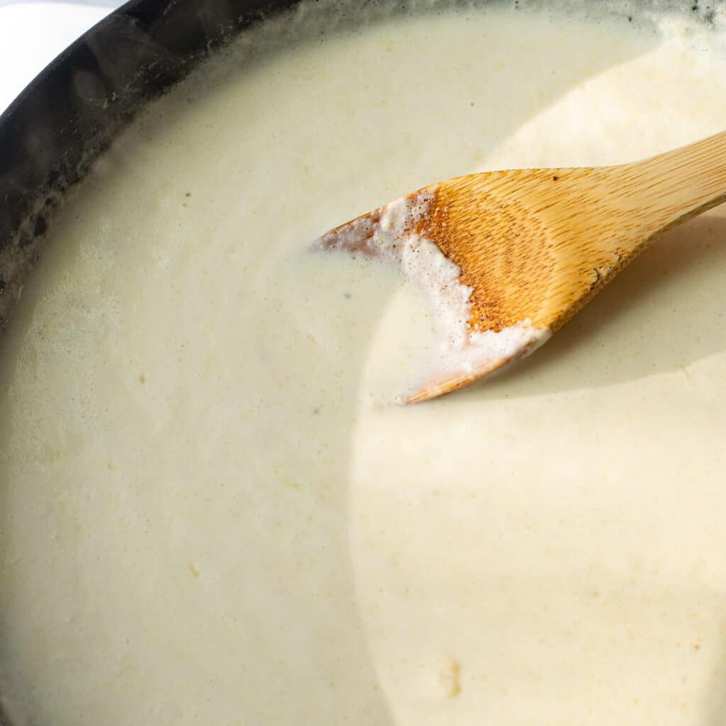 cream sauce cooking in a pan