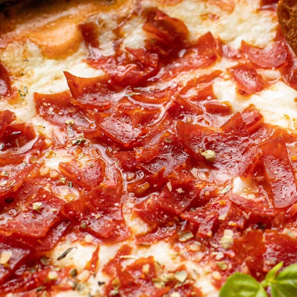 close up view of chopped pepperoni pizza dip
