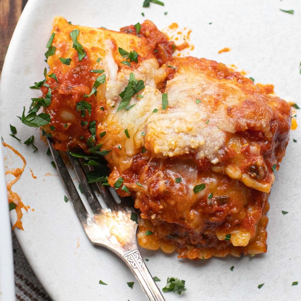 a serving of baked ravioli on a white plate