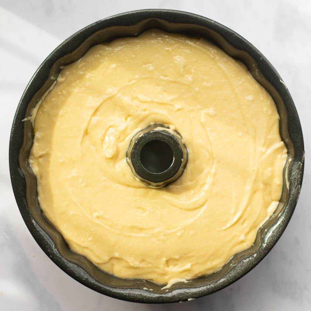 bourbon sour cream cake batter in a bundt pan