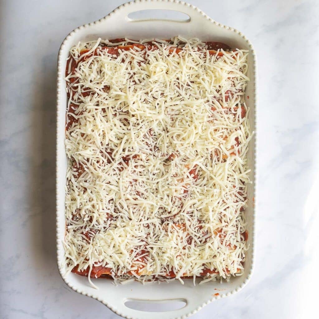 lasagna roll ups in a baking dish before baking