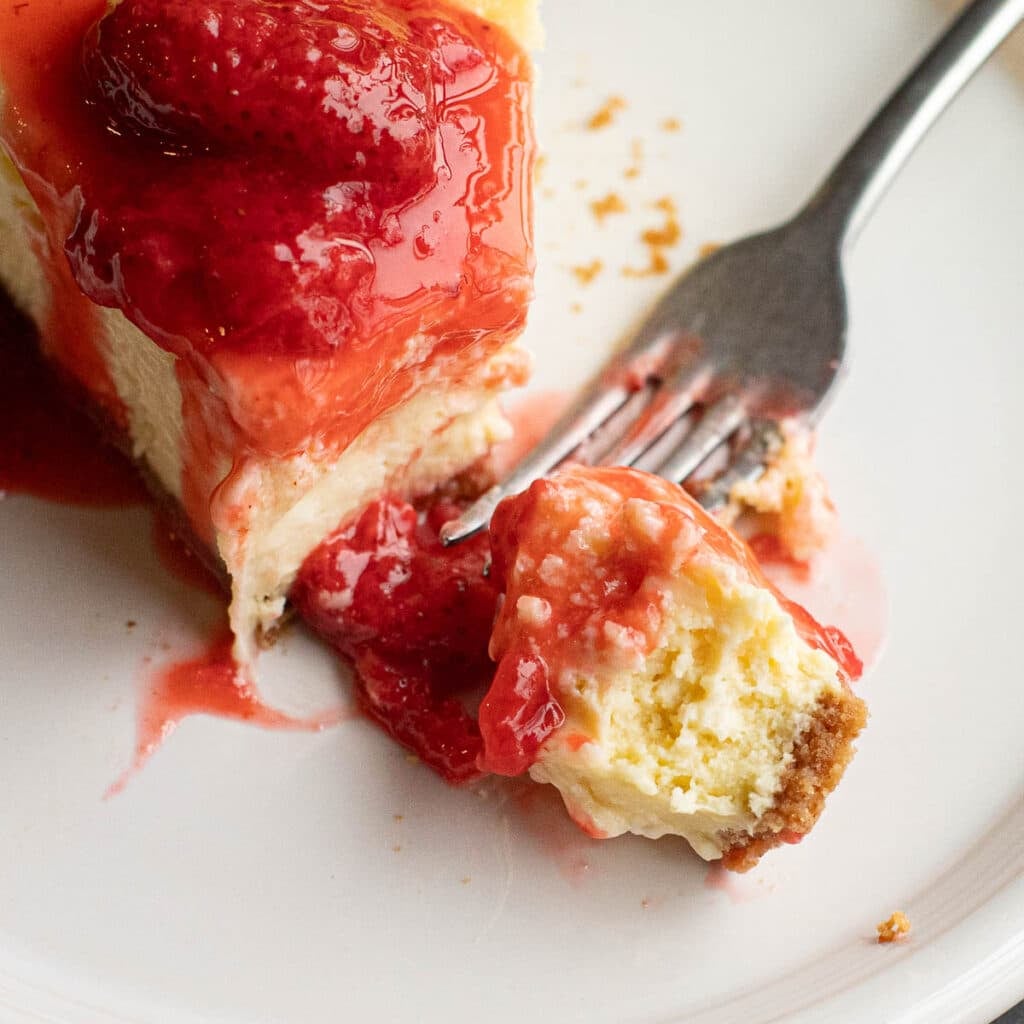 New York Cheesecake topped with strawberry sauce