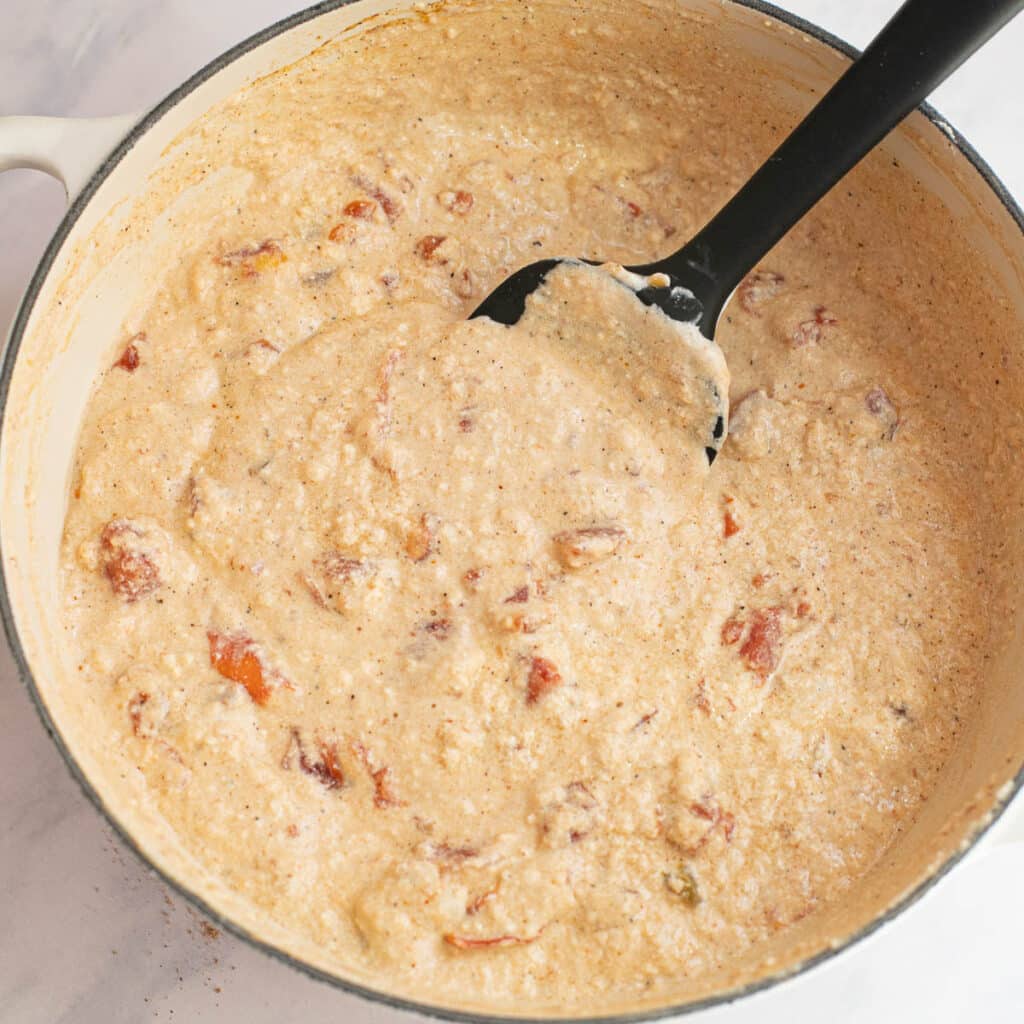 cottage cheese queso cooking in a saucepan