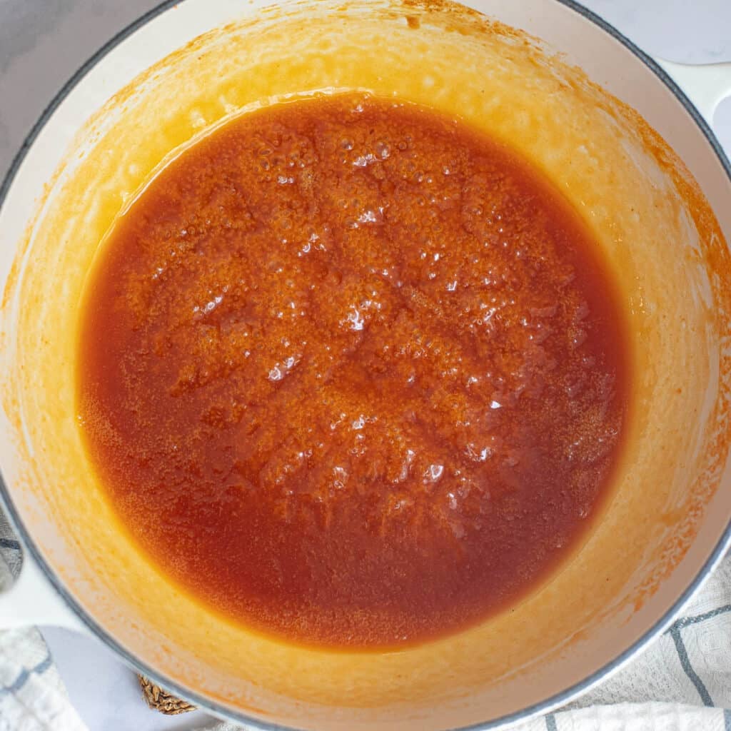 hot honey sauce cooking in a saucepan
