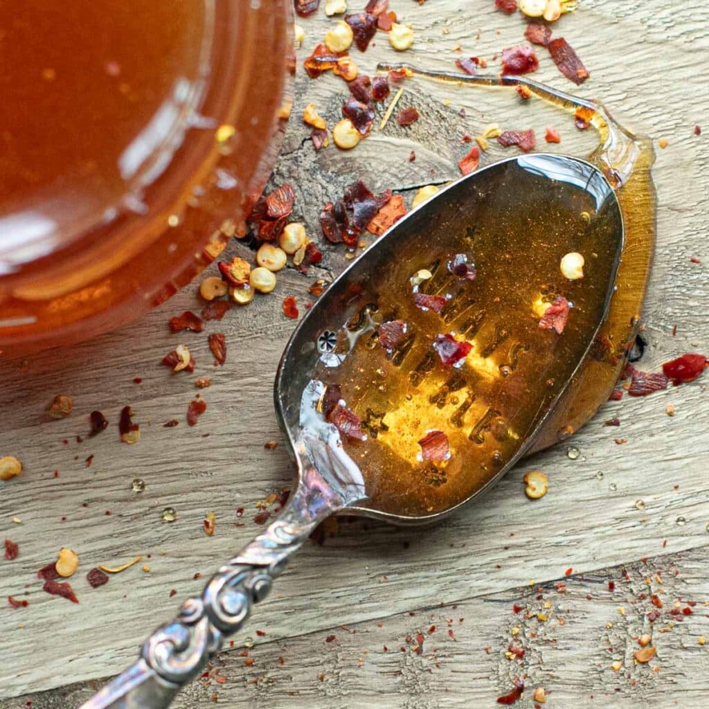 hot honey in a silver spoon