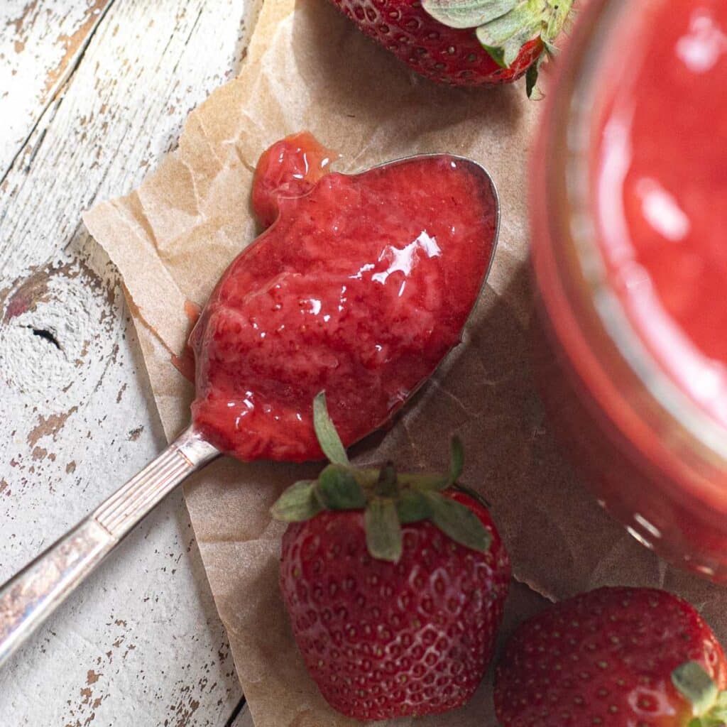 strawberry sauce on a silver spoon