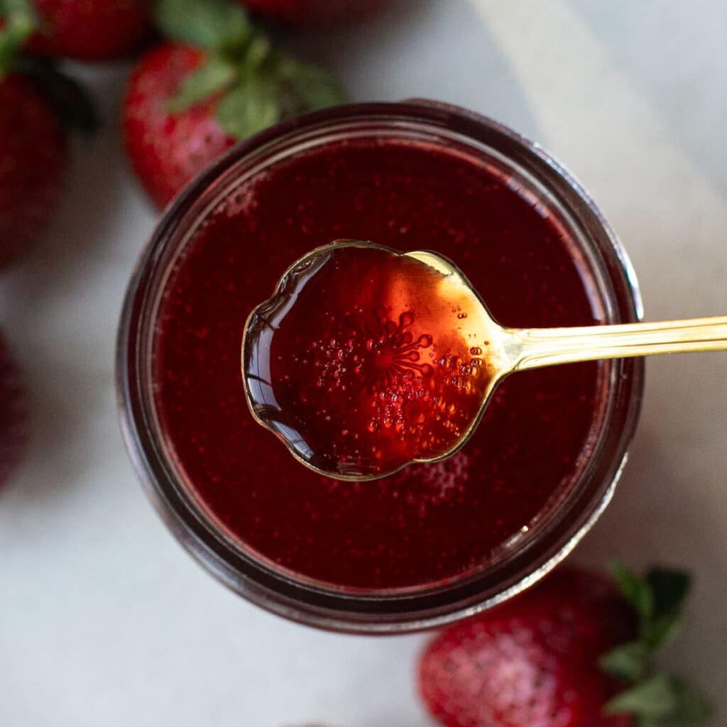 a small spoonful of strawberry syrup