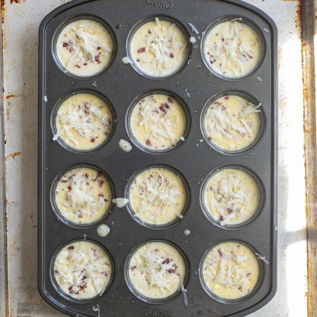 Starbucks egg bites in a muffin pan before baking