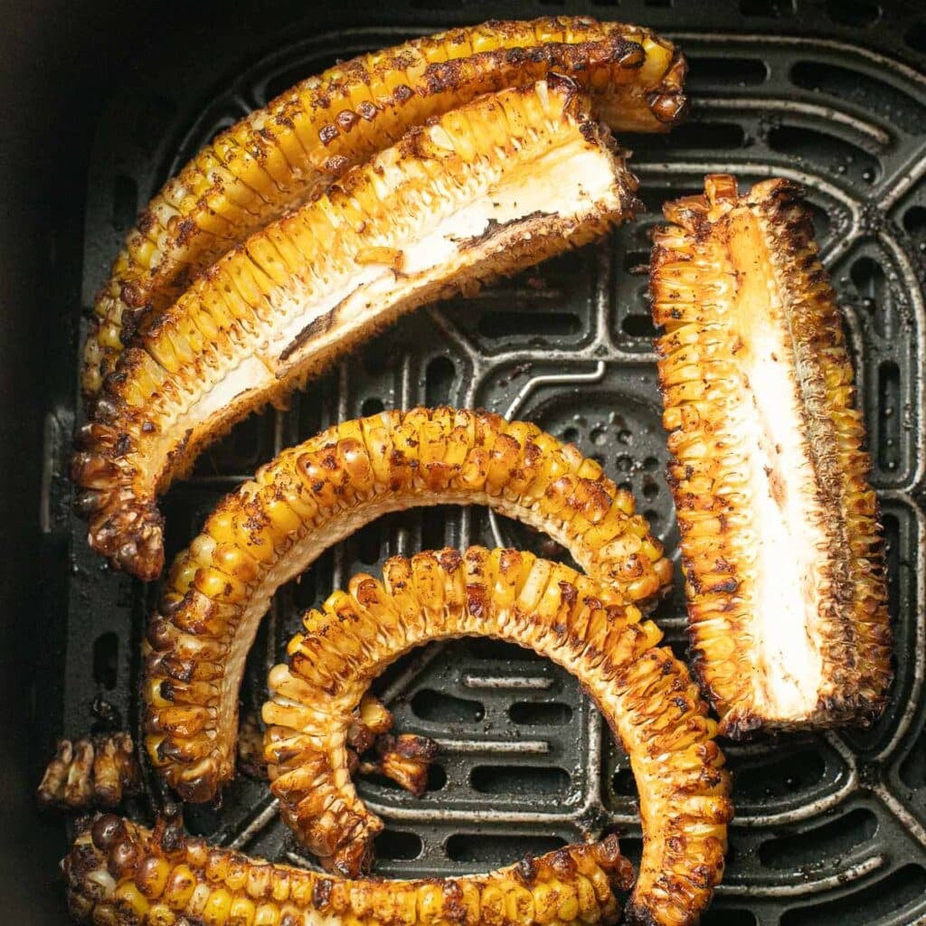 air fryer corn ribs in the basket of an air fryer