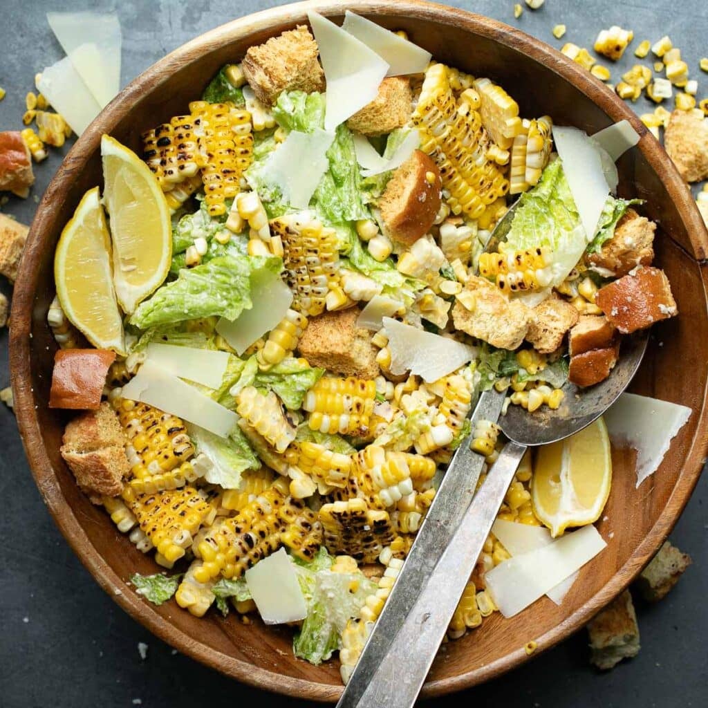 corn Caesar salad in a wooden bowl