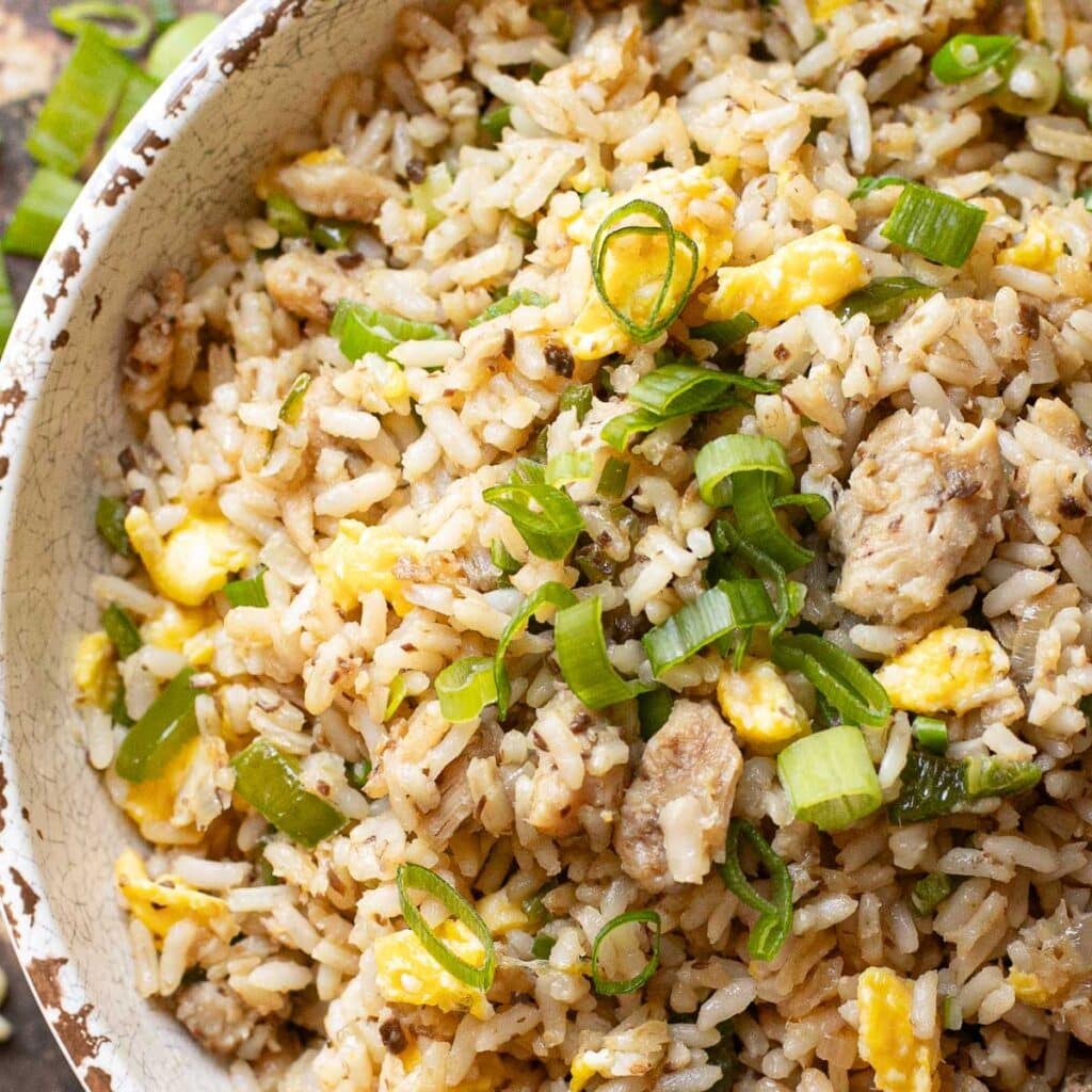 sardine fried rice in a white bowl
