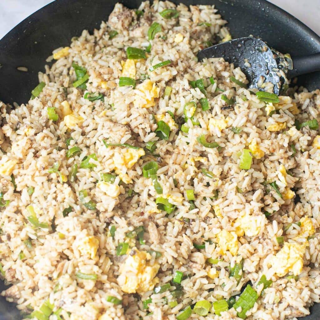 sardine fried rice cooking in a pan