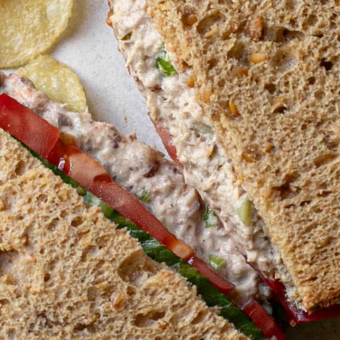 close up view of sardine sandwich on multigrain bread