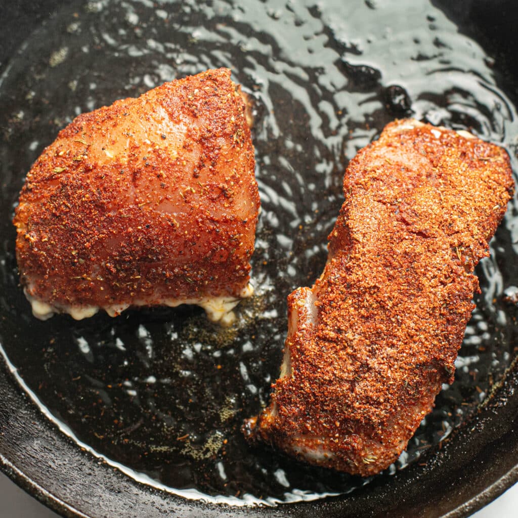 snapper frying in a cast iron pan