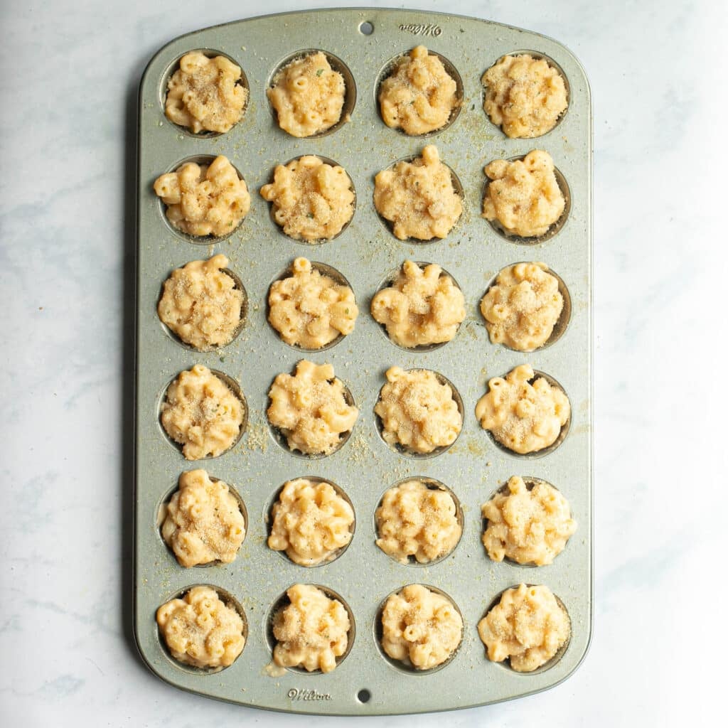 mac and cheese in mini muffin pan before baking
