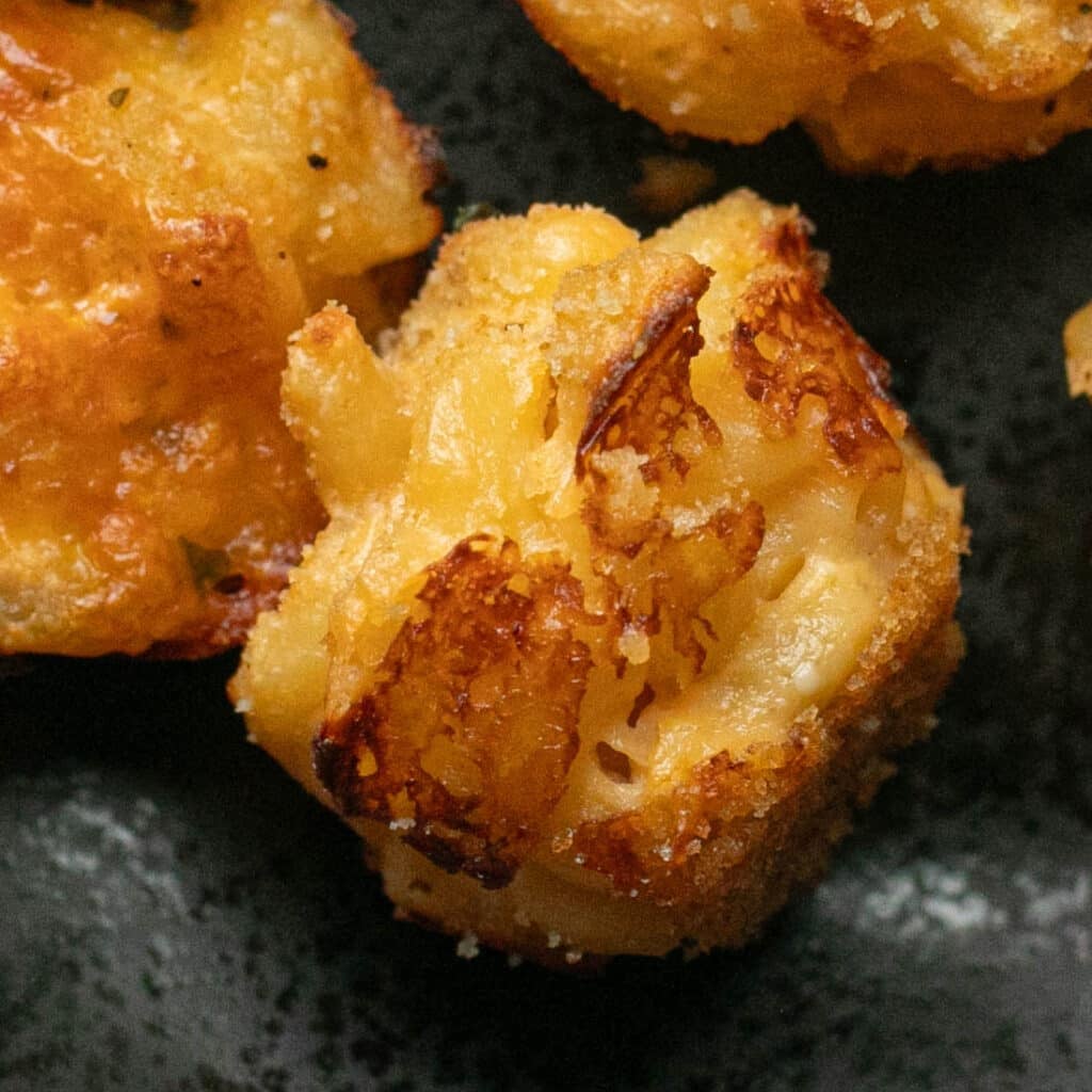 sideways view of a mac and cheese bite