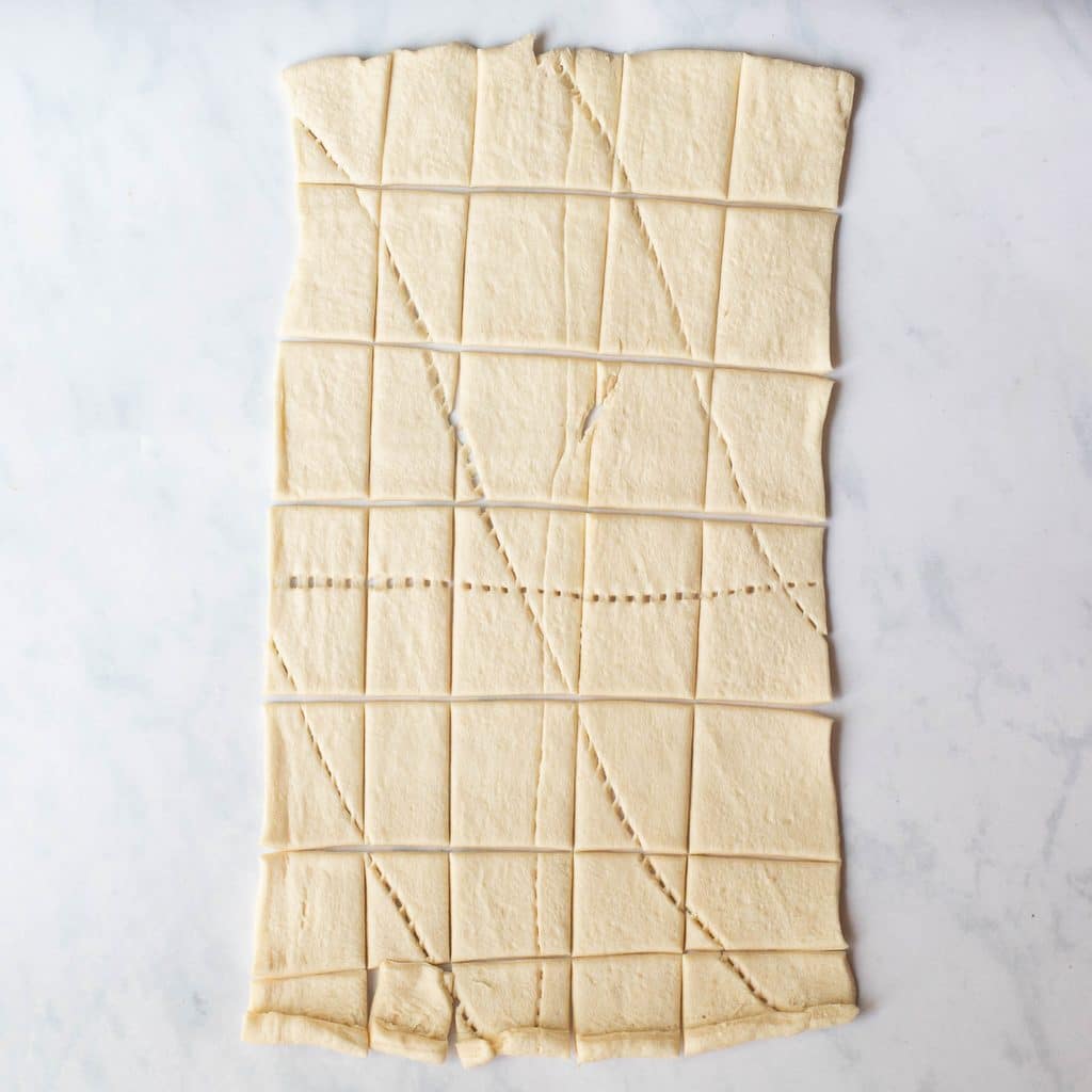 sheet of crescent rolls cut into squares