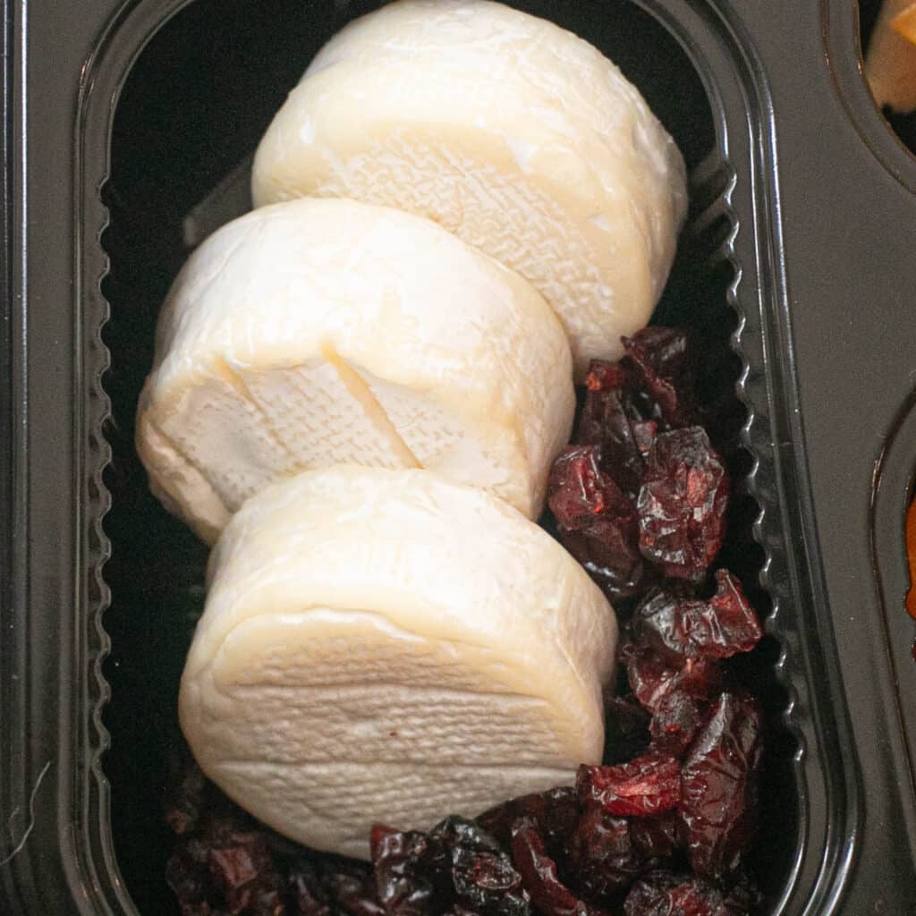 mini brie cheese wheels and dried cranberries