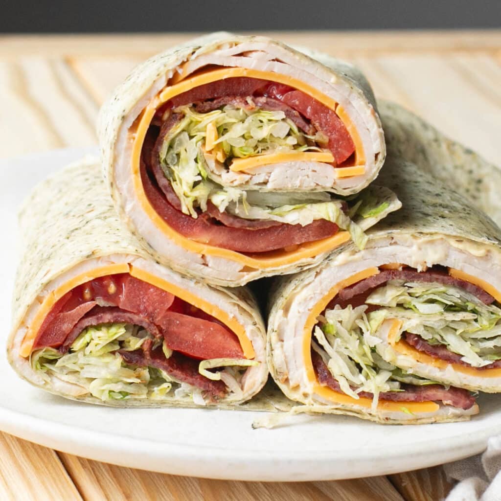 three BLT turkey wraps stacked on each other