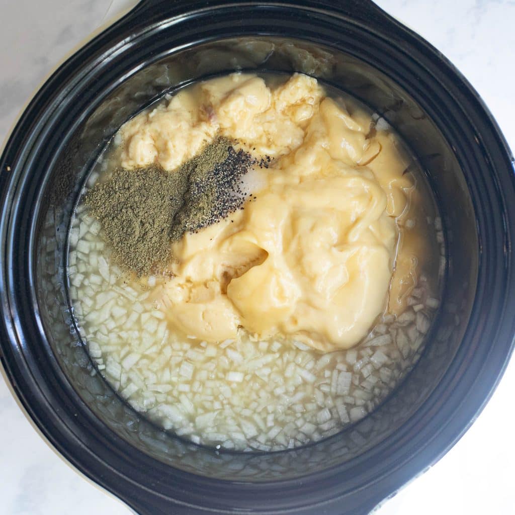 chopped onions, cream of chicken soup and seasonings in a crock pot