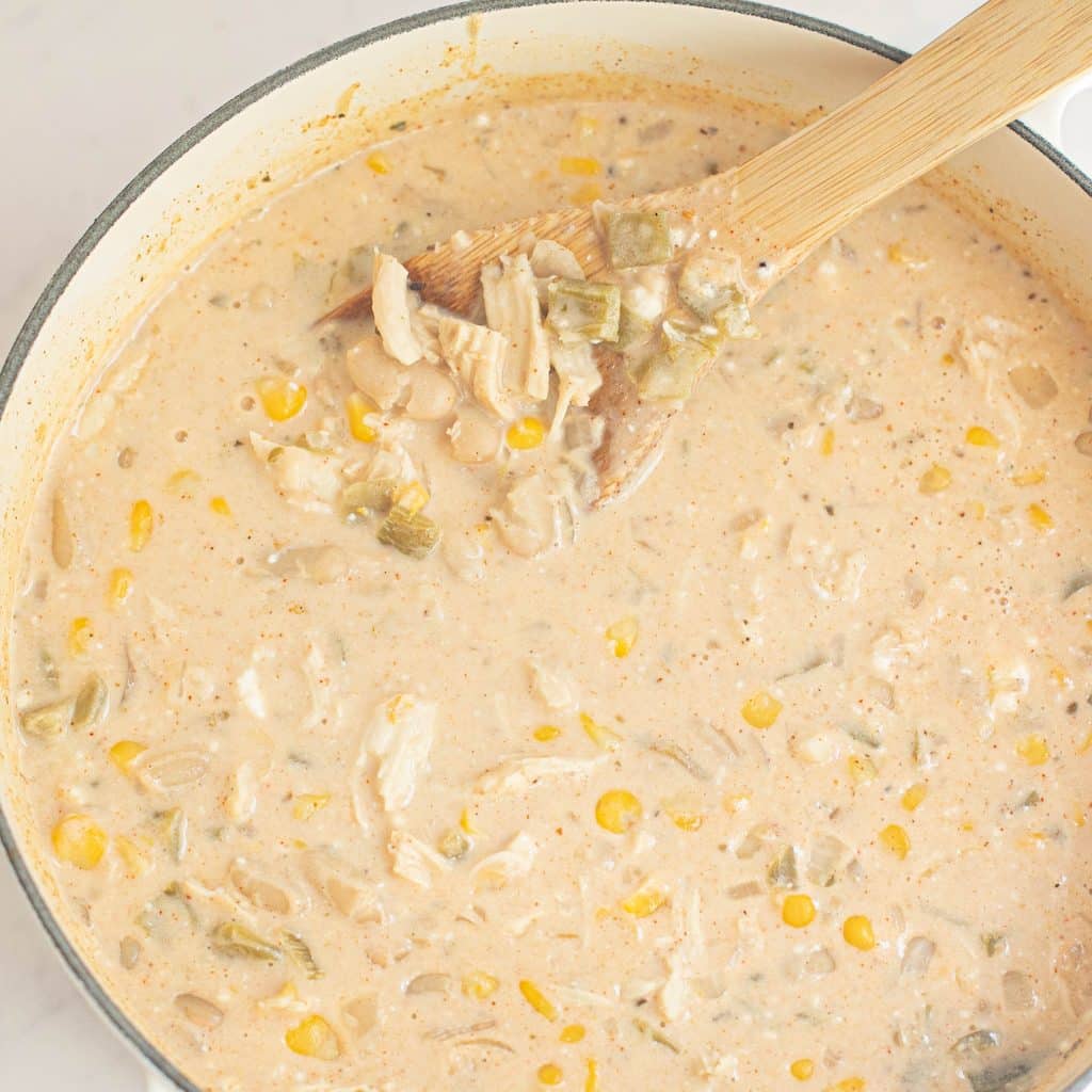 white chicken chili cooking in a Dutch oven