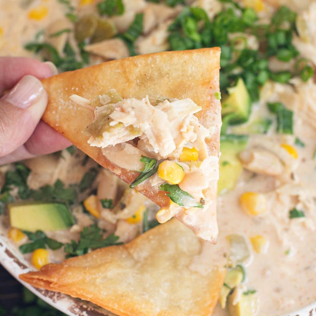 a tortilla chip topped with white chicken chili