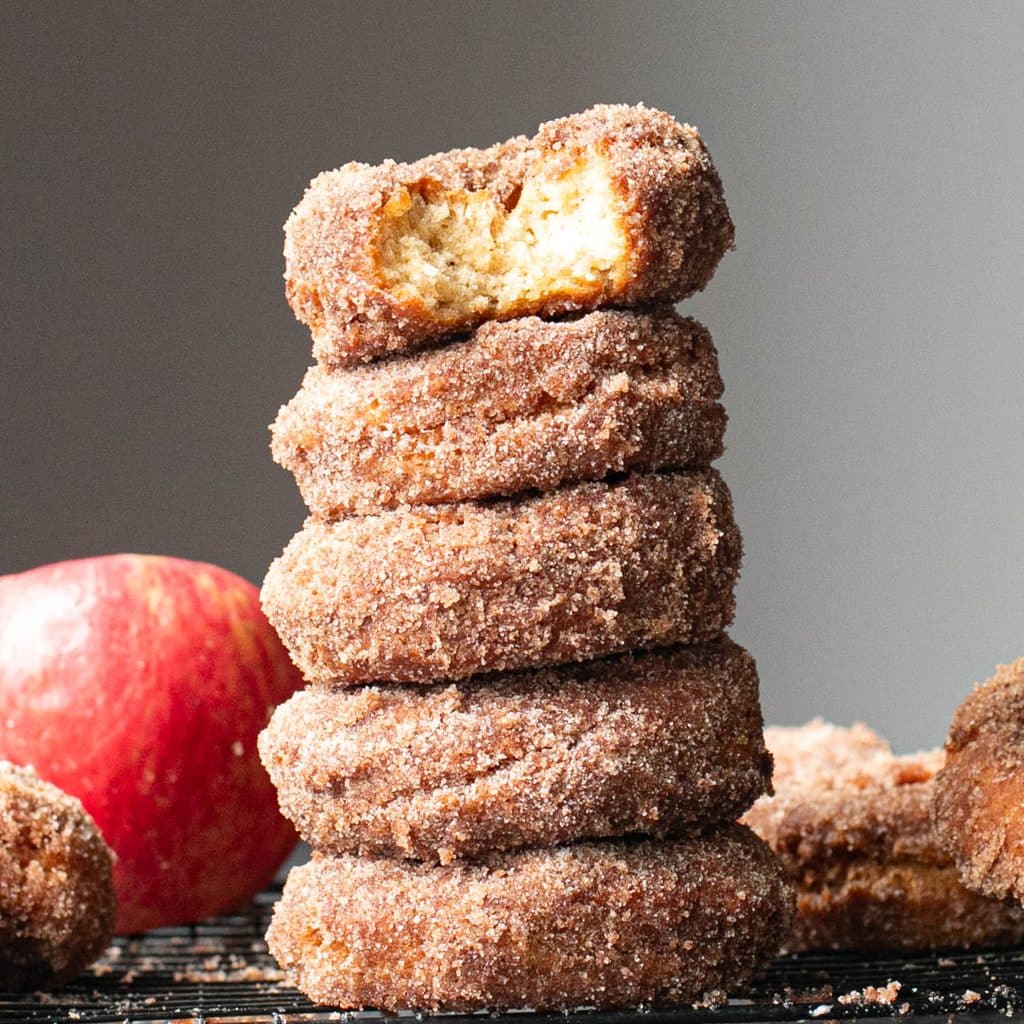 apple cider donuts stacked in a tower