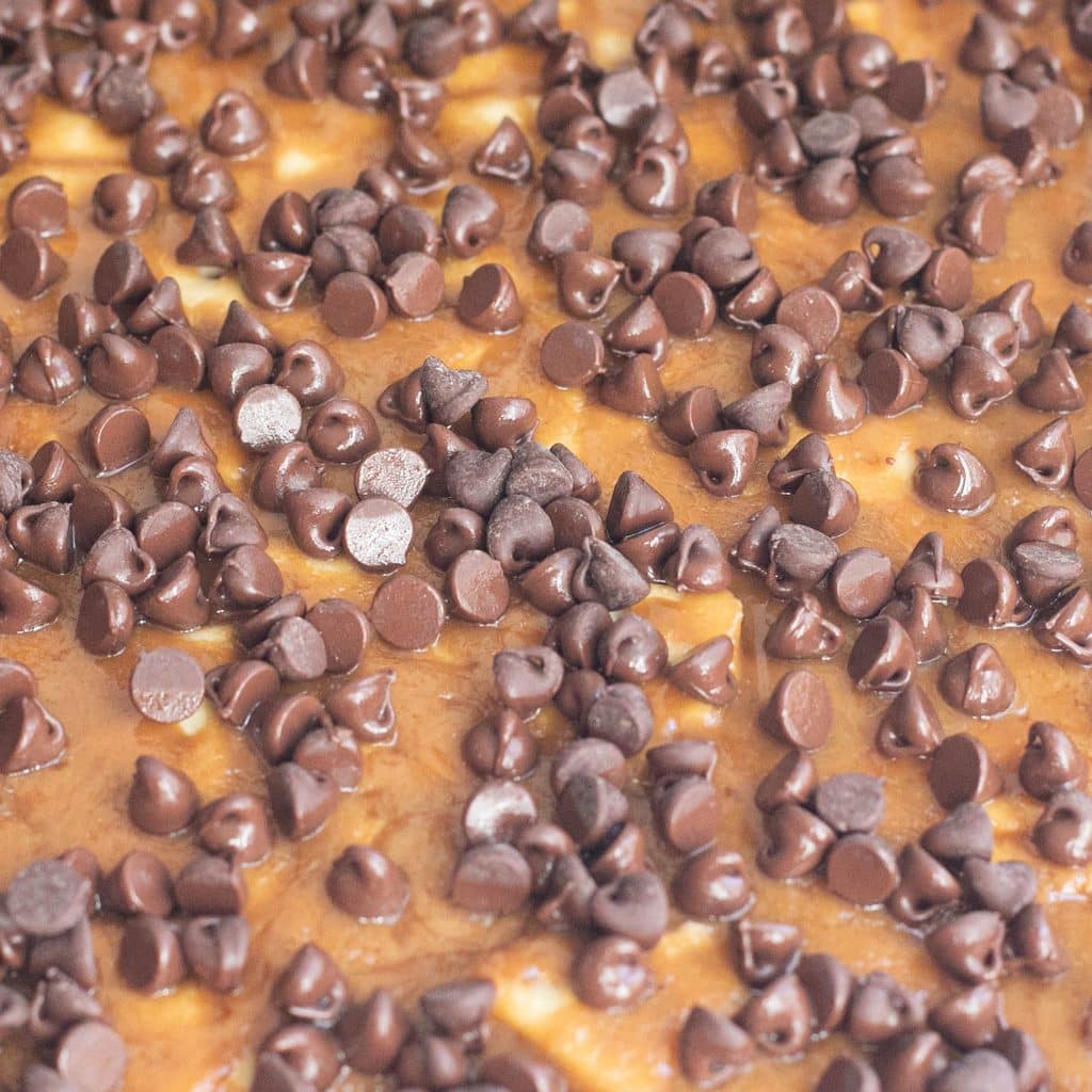 chocolate chips melting on hot toffee
