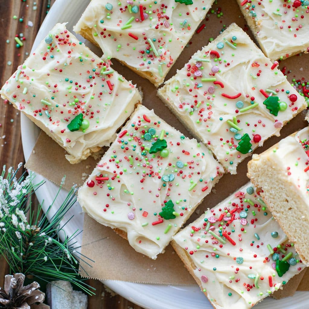 Christmas sugar cookie bars on a white plate