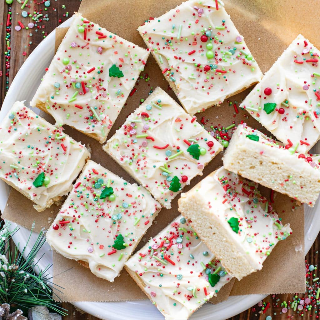 Christmas sugar cookie bars on a white plate