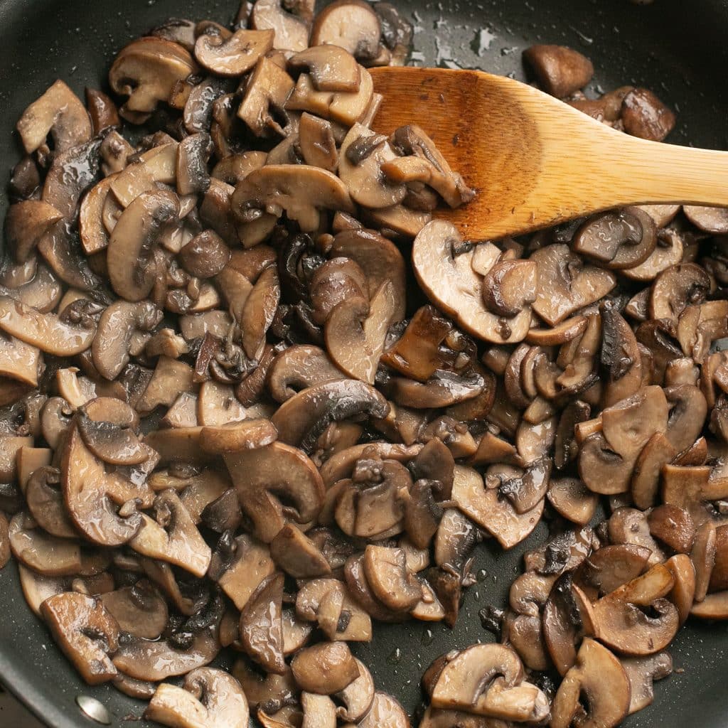 mushrooms sauteing in a pan