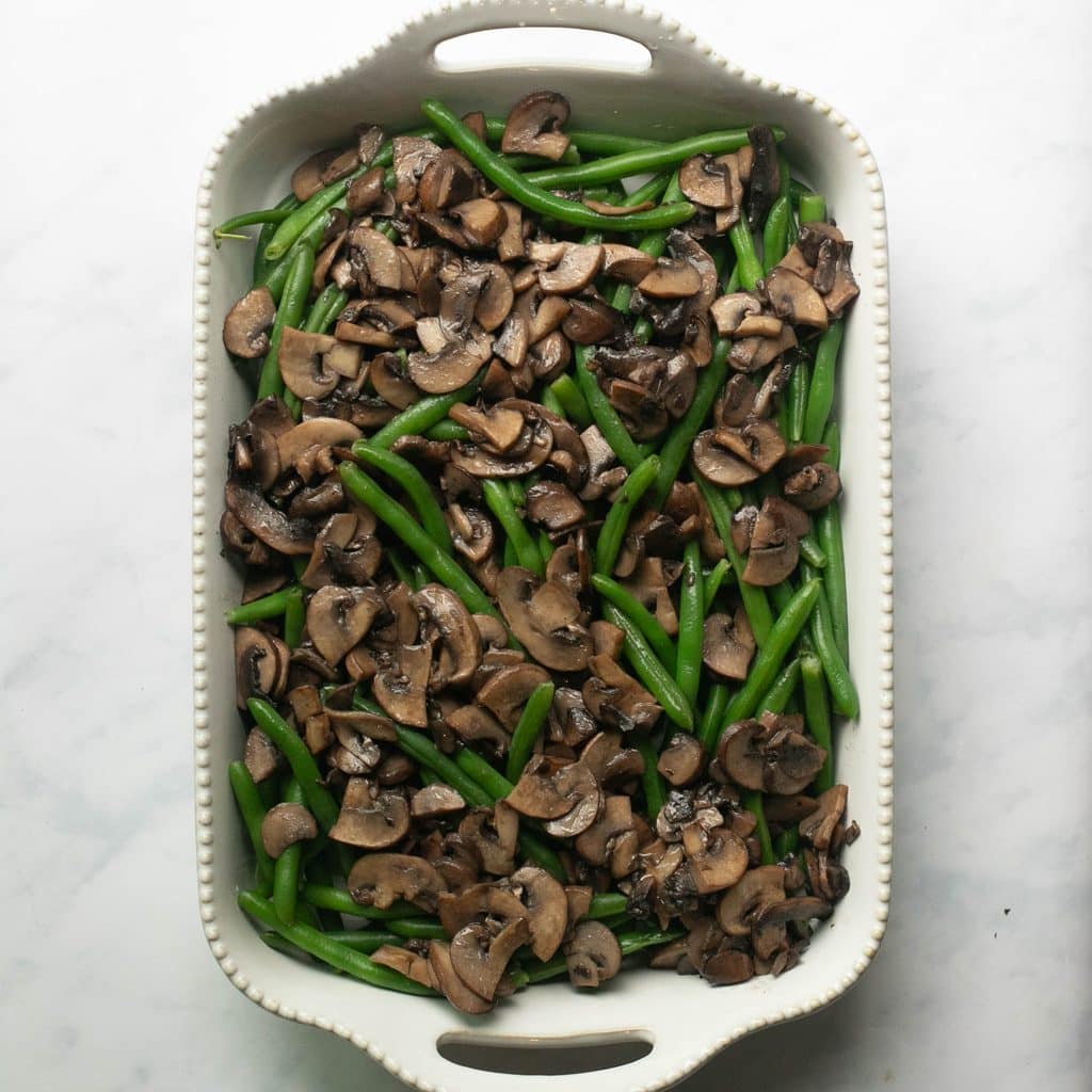 green beans and mushrooms in a casserole dish