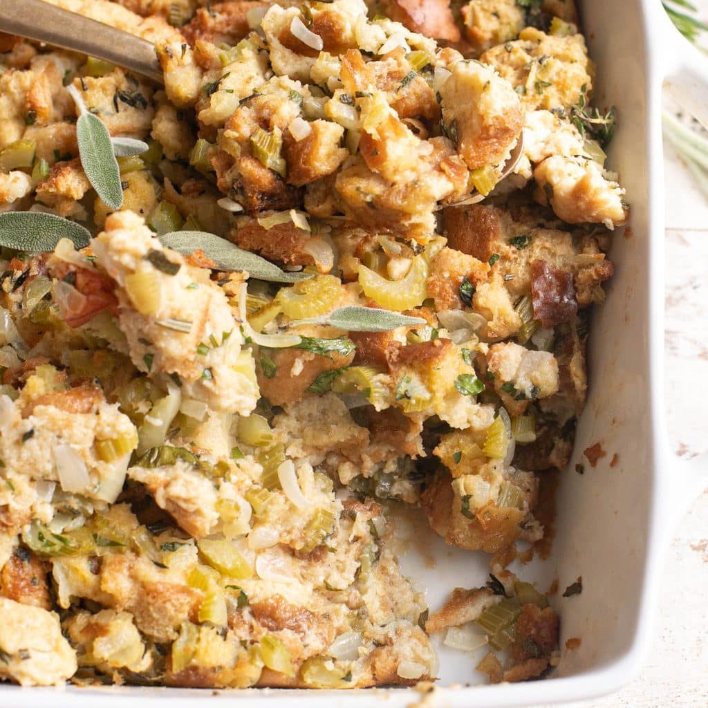 homemade stuffing in a white baking dish