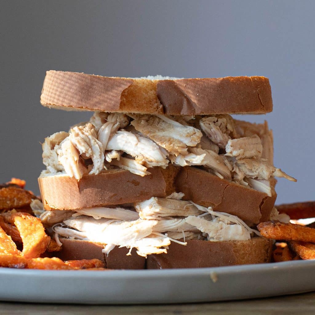 triple decker turkey sandwich on white bread