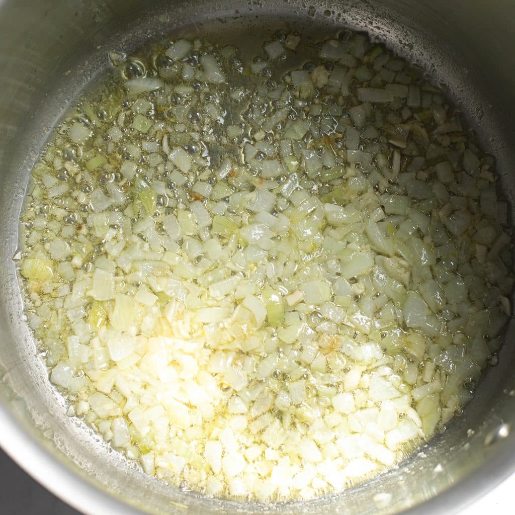 diced onions cooking in a pot