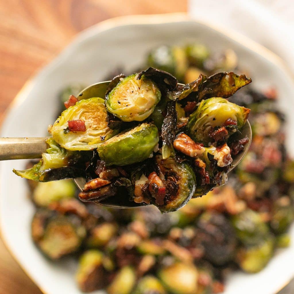 a large serving spoonful of maple bacon Brussels sprouts