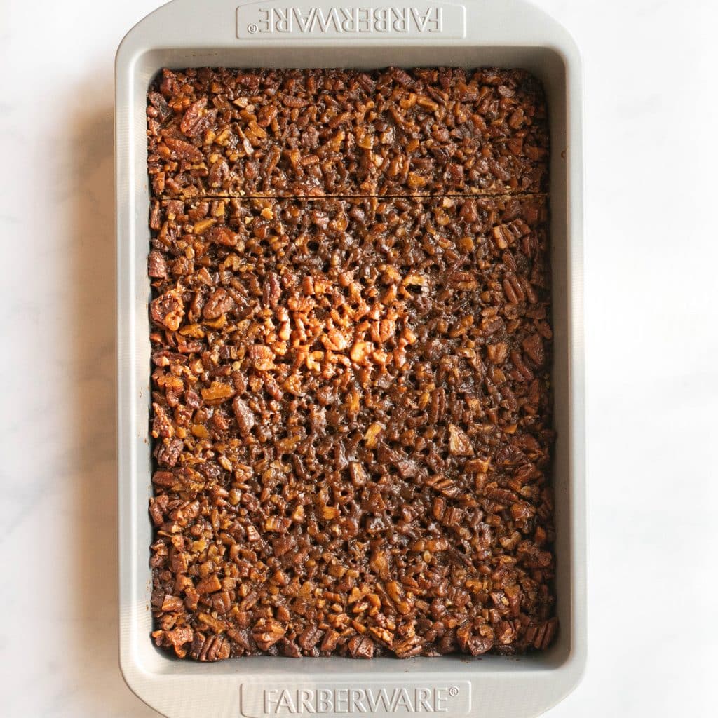 pecan bars in a baking pan before slicing