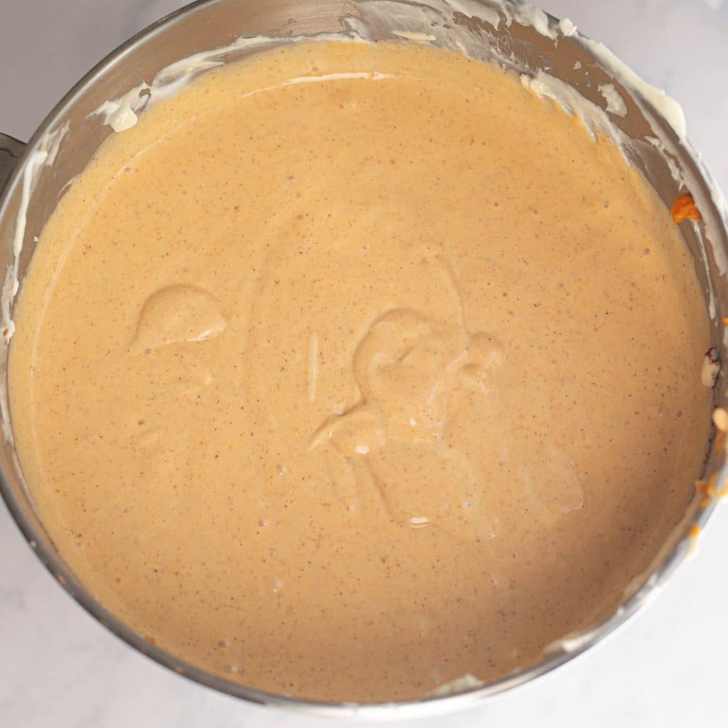pumpkin cheesecake batter in a mixing bowl